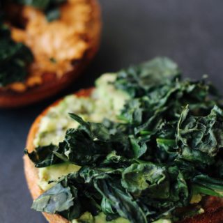 Crispy Kale Sandwiches. An easy, #vegan and #vegetarian breakfast idea: layer crispy kale on top of salted avocado and peanut butter.